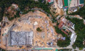 Aerial surveying view of a large urban construction site being prepared for a future park project