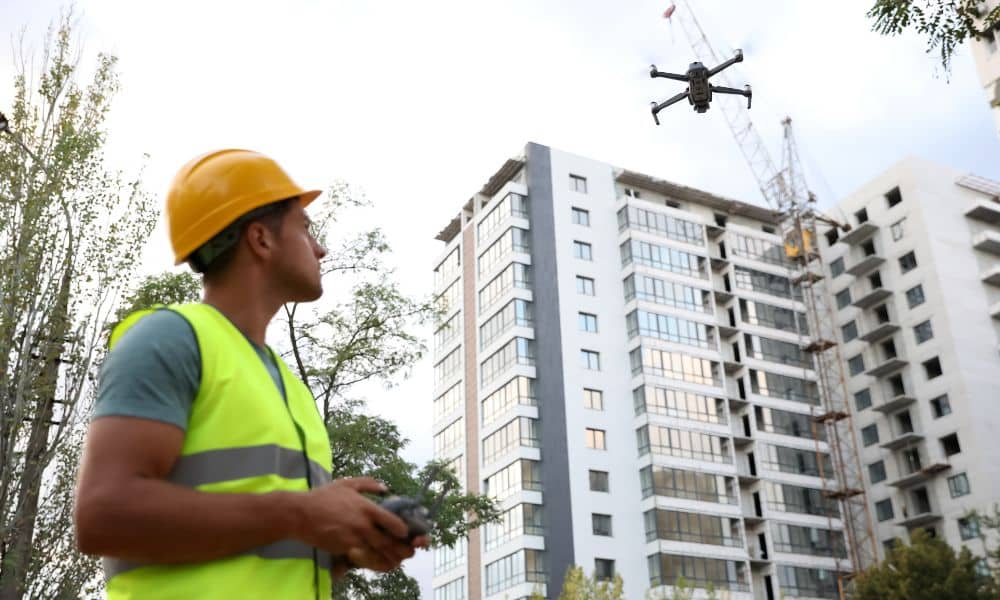 Drone capturing terrain data for lidar mapping on a construction site