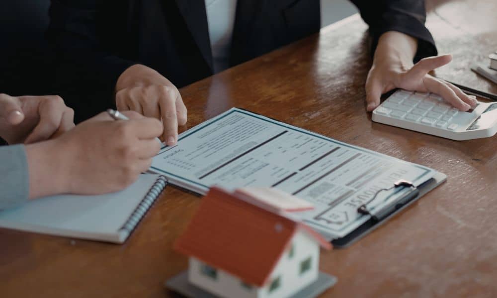 Commercial closing documents review - ALTA SURVEY Missouri Buyers and lender reviewing documents related to an ALTA land survey certification before closing