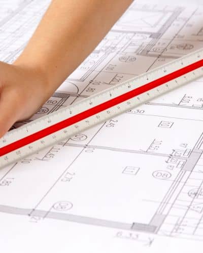 Survey plat document measurement - ALTA SURVEY Missouri Close-up of a survey document with scale ruler used during preparation of an ALTA land survey certification