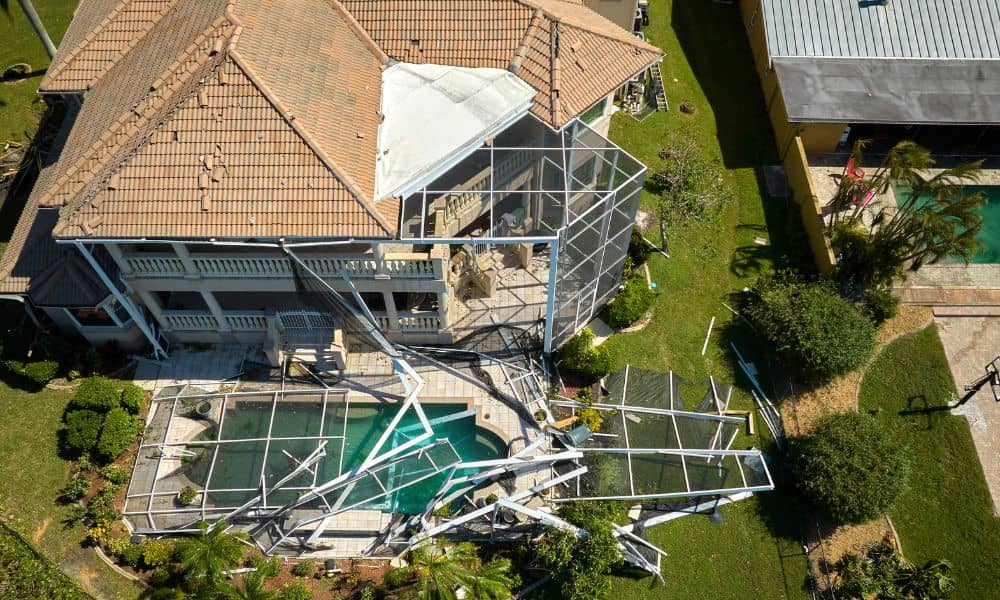 Aerial view of a storm-damaged home showing property layout and changes identified through survey mapping