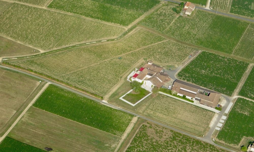 Aerial view of agricultural fields and farm properties showing clearly defined parcel boundaries for a boundary survey